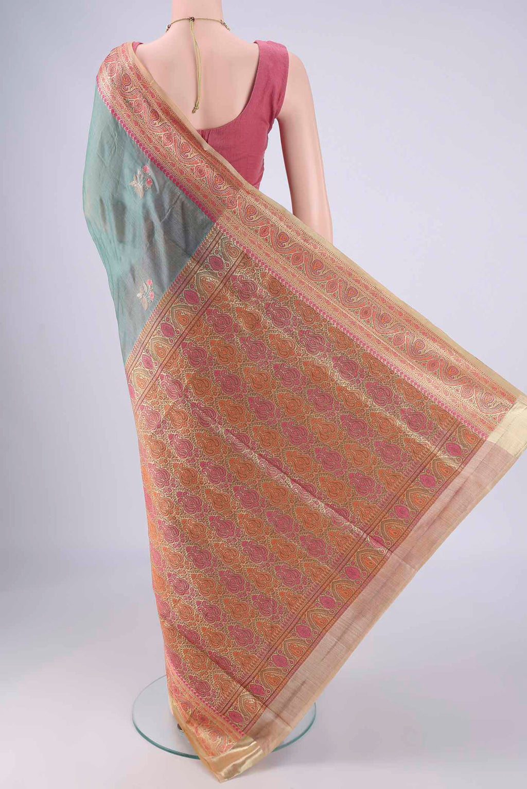 Flat view of Light Green Banarasi Tussar Silk Saree with Embroidery on the body and Zari Border. 