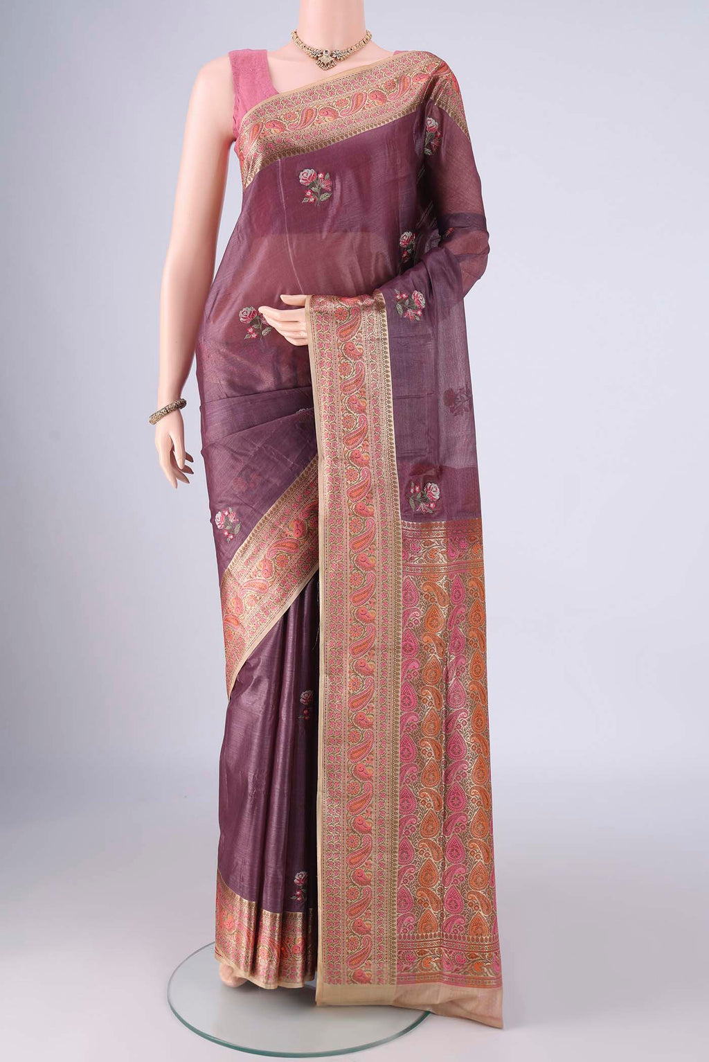 Mauve Banarasi Tussar Silk Saree with Embroidery on the body and Zari Border.  displayed on a mannequin