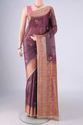 Mauve Banarasi Tussar Silk Saree with Embroidery on the body and Zari Border.  displayed on a mannequin