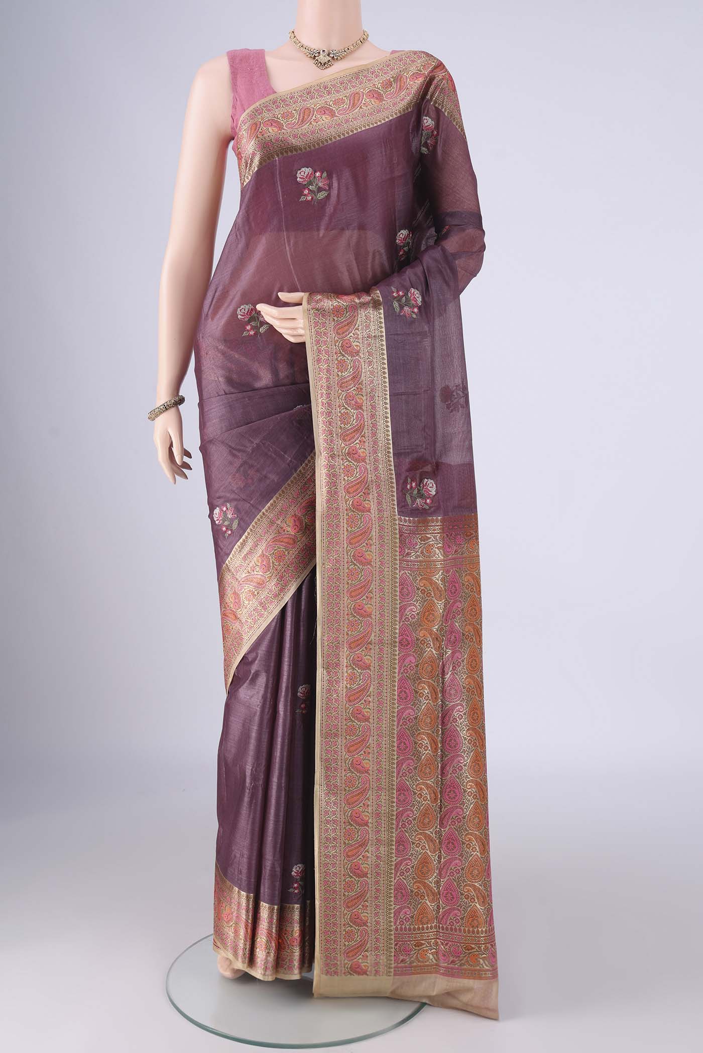 Mauve Banarasi Tussar Silk Saree with Embroidery on the body and Zari Border.  displayed on a mannequin