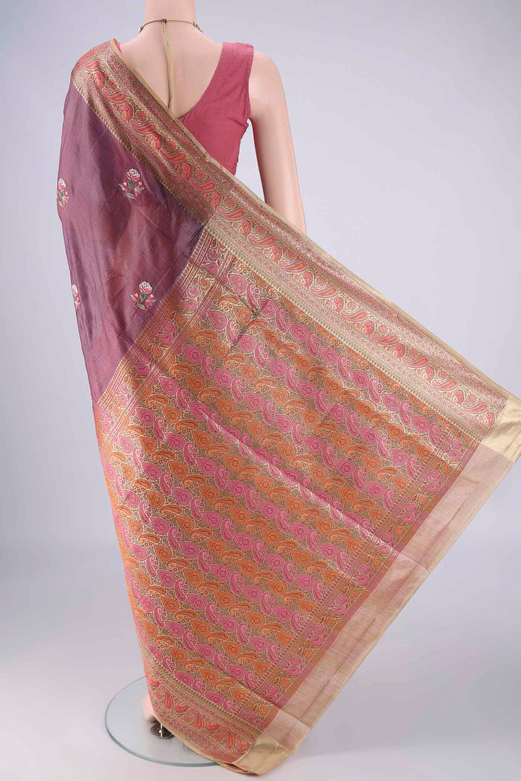 Flat view of Mauve Banarasi Tussar Silk Saree with Embroidery on the body and Zari Border. 