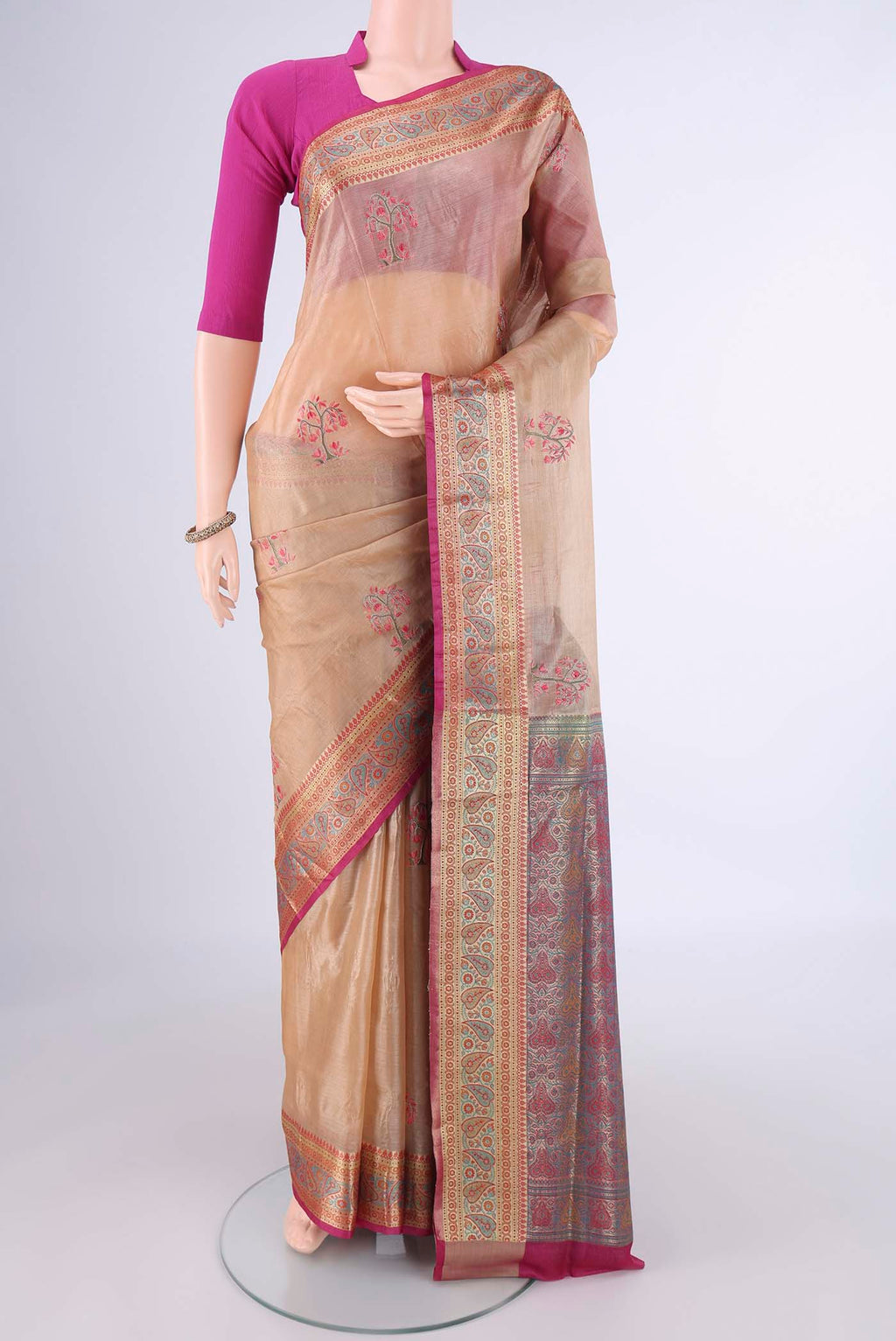 Beige Banarasi Tussar Silk Saree with Embroidery on the body and Zari Border.  displayed on a mannequin