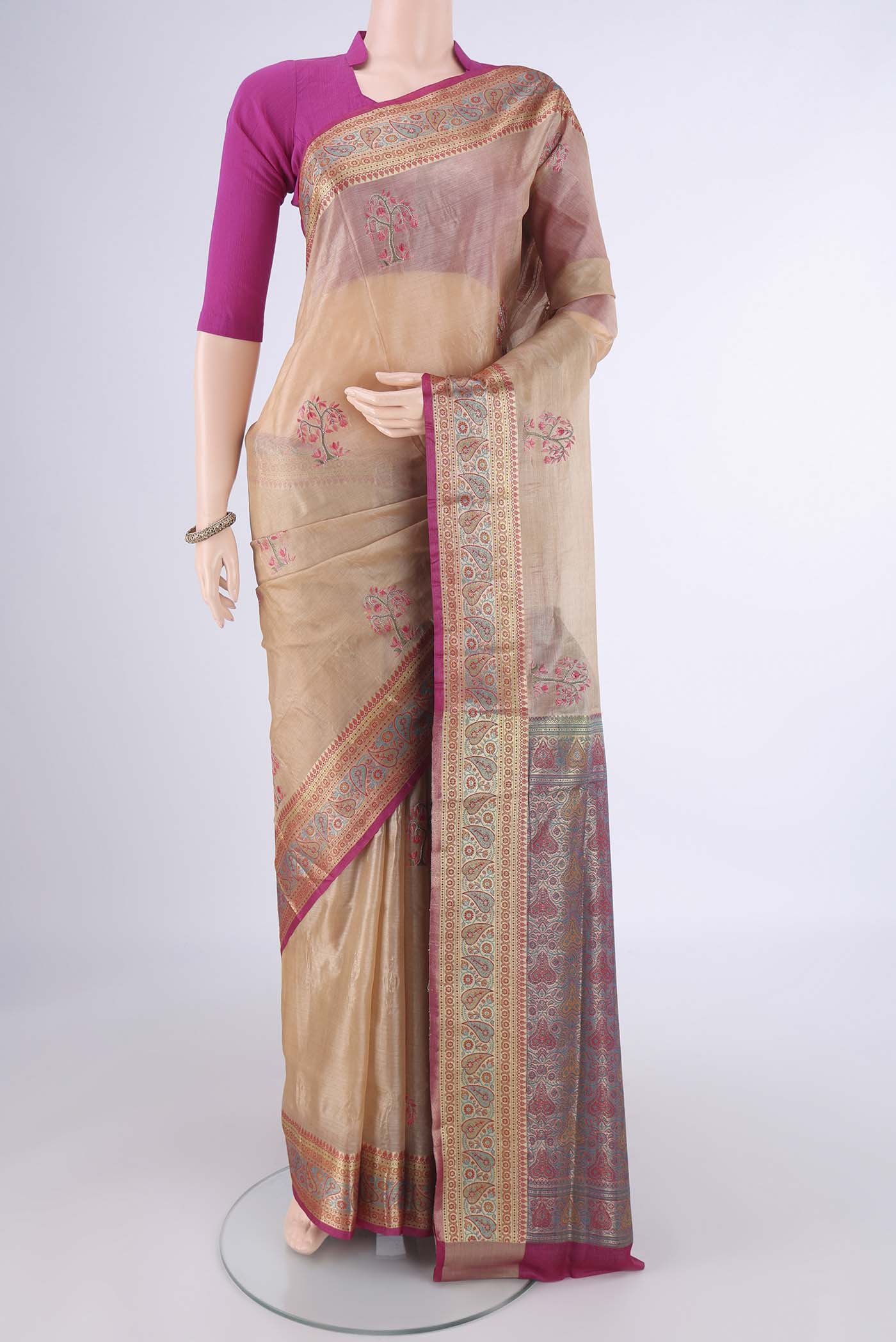 Beige Banarasi Tussar Silk Saree with Embroidery on the body and Zari Border.  displayed on a mannequin