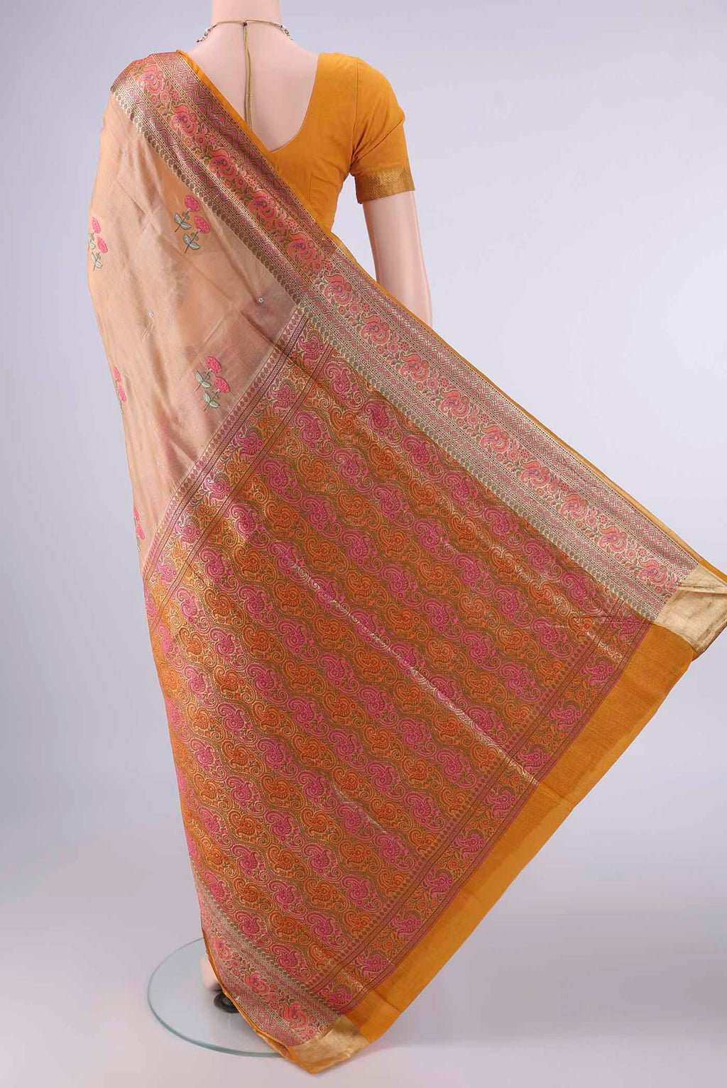 Flat view of Sandal Banarasi Tussar Saree with Embroidery on the body and Zari Border. 