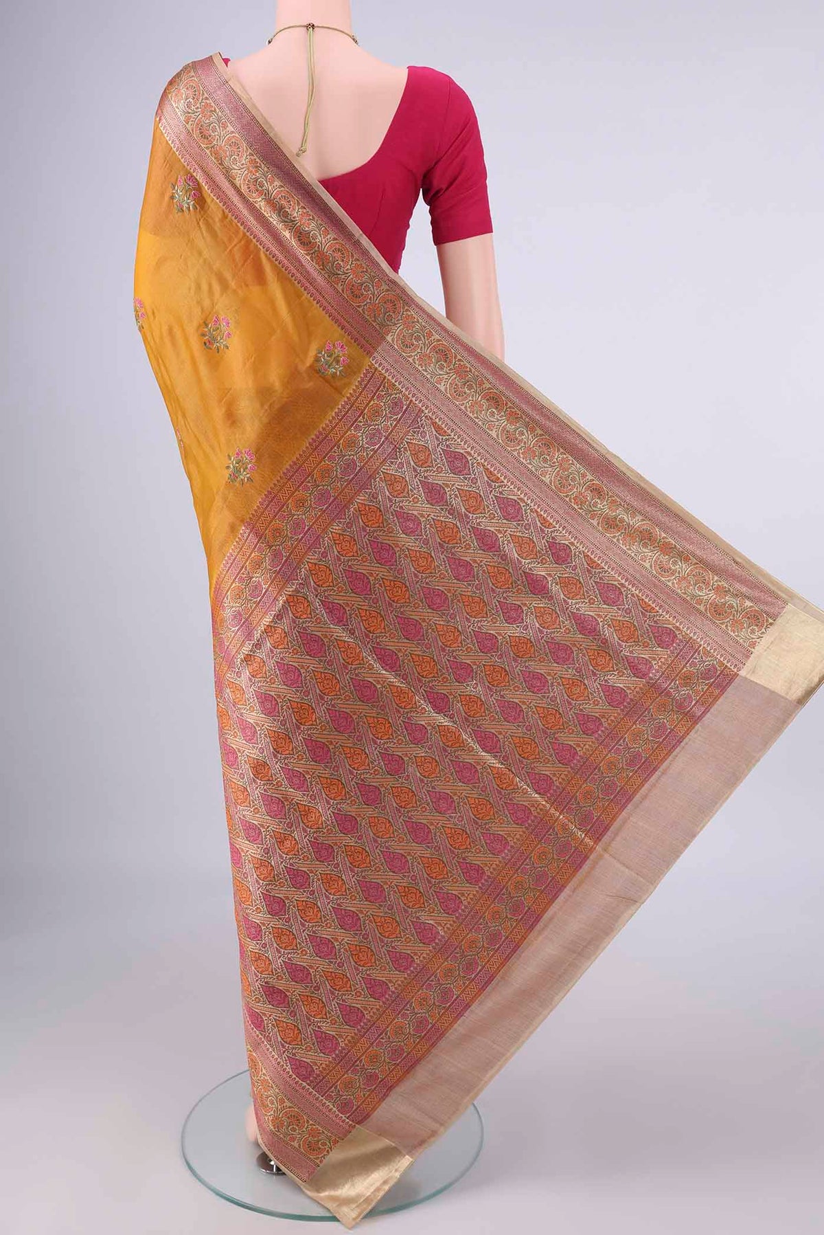 Flat view of Mustard Banarasi Tussar Saree with Embroidery on the body and Zari Border. 