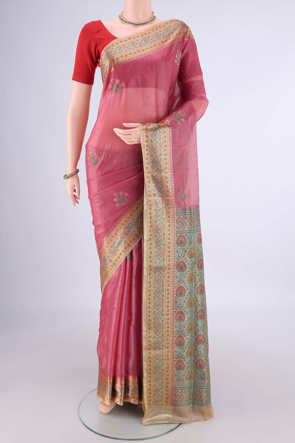 Pink Banarasi Tussar Silk Saree with Embroidery on the body and Zari Border.  displayed on a mannequin