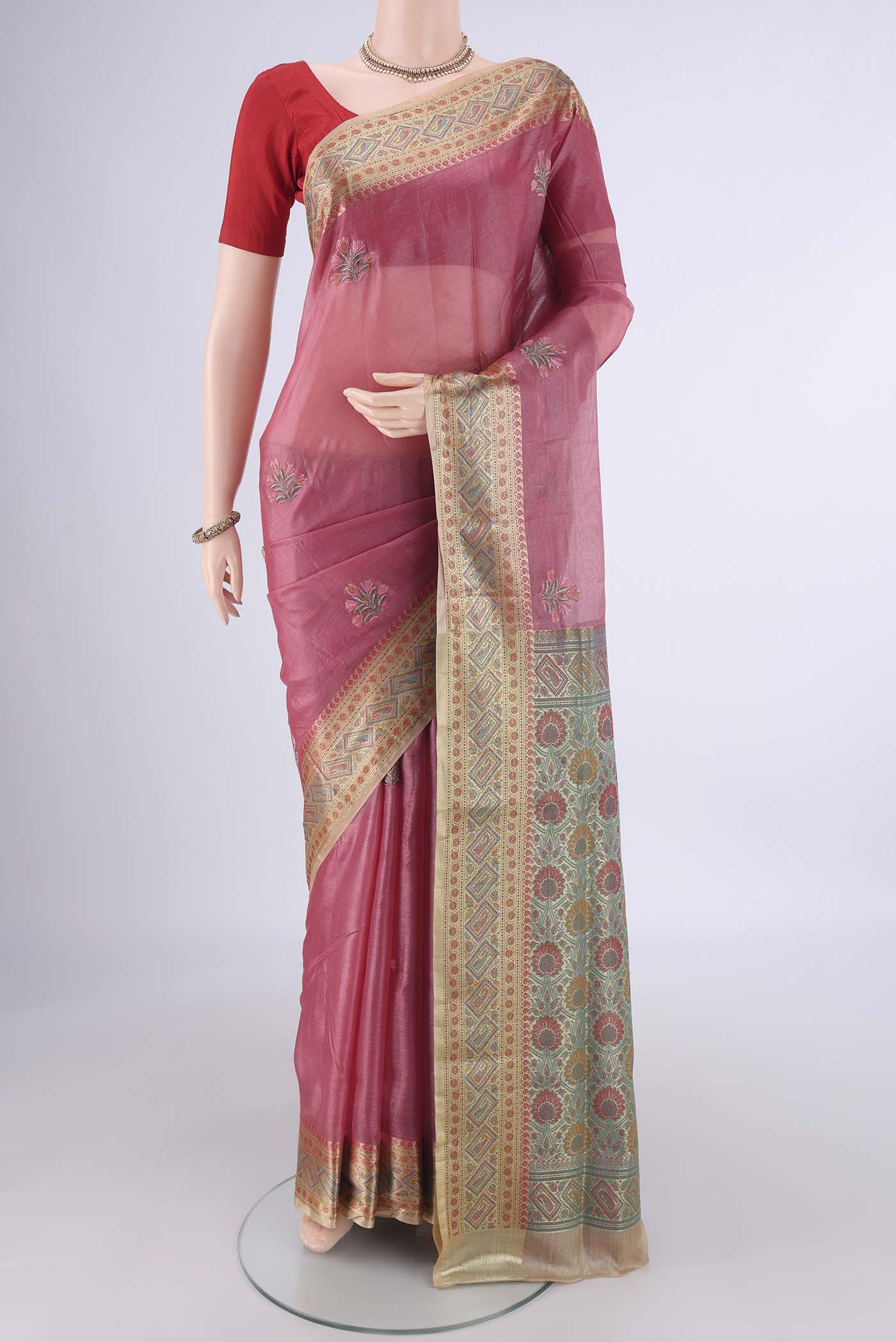 Pink Banarasi Tussar Silk Saree with Embroidery on the body and Zari Border.  displayed on a mannequin
