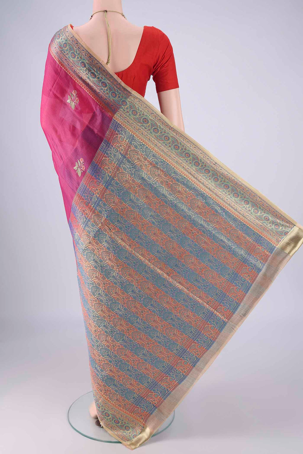 Flat view of Dark Pink Banarasi Tussar Silk Saree with Embroidery on the body and Zari Border. 
