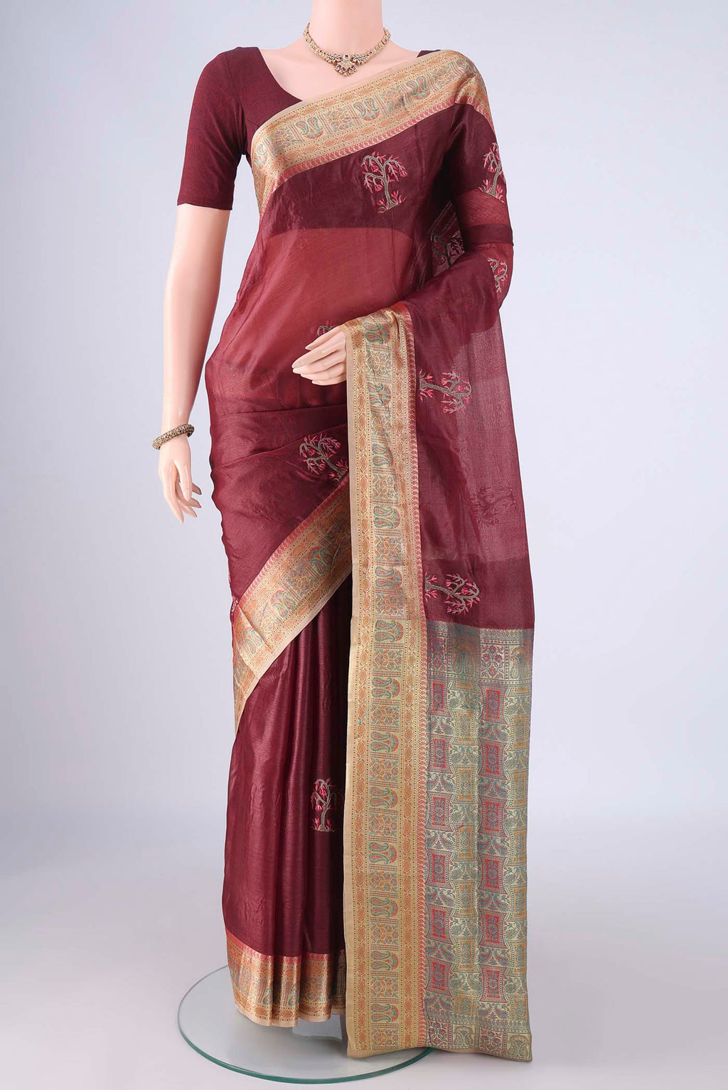 Coffee Brown Banarasi Tussar Silk Saree with Embroidery on the body and Zari Border.  displayed on a mannequin