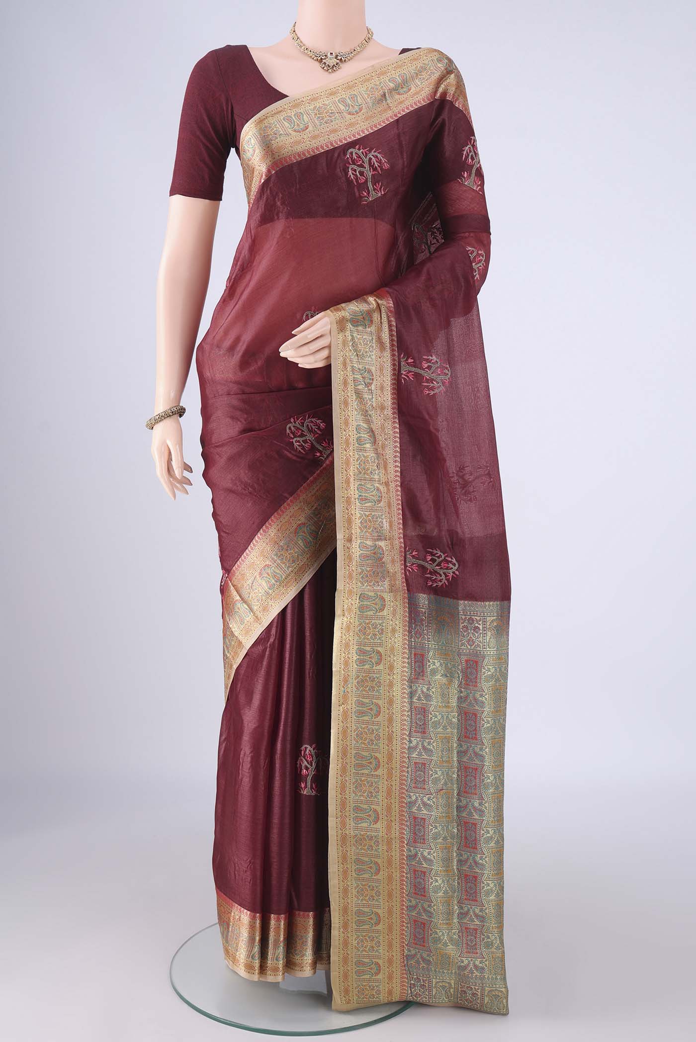 Coffee Brown Banarasi Tussar Silk Saree with Embroidery on the body and Zari Border.  displayed on a mannequin