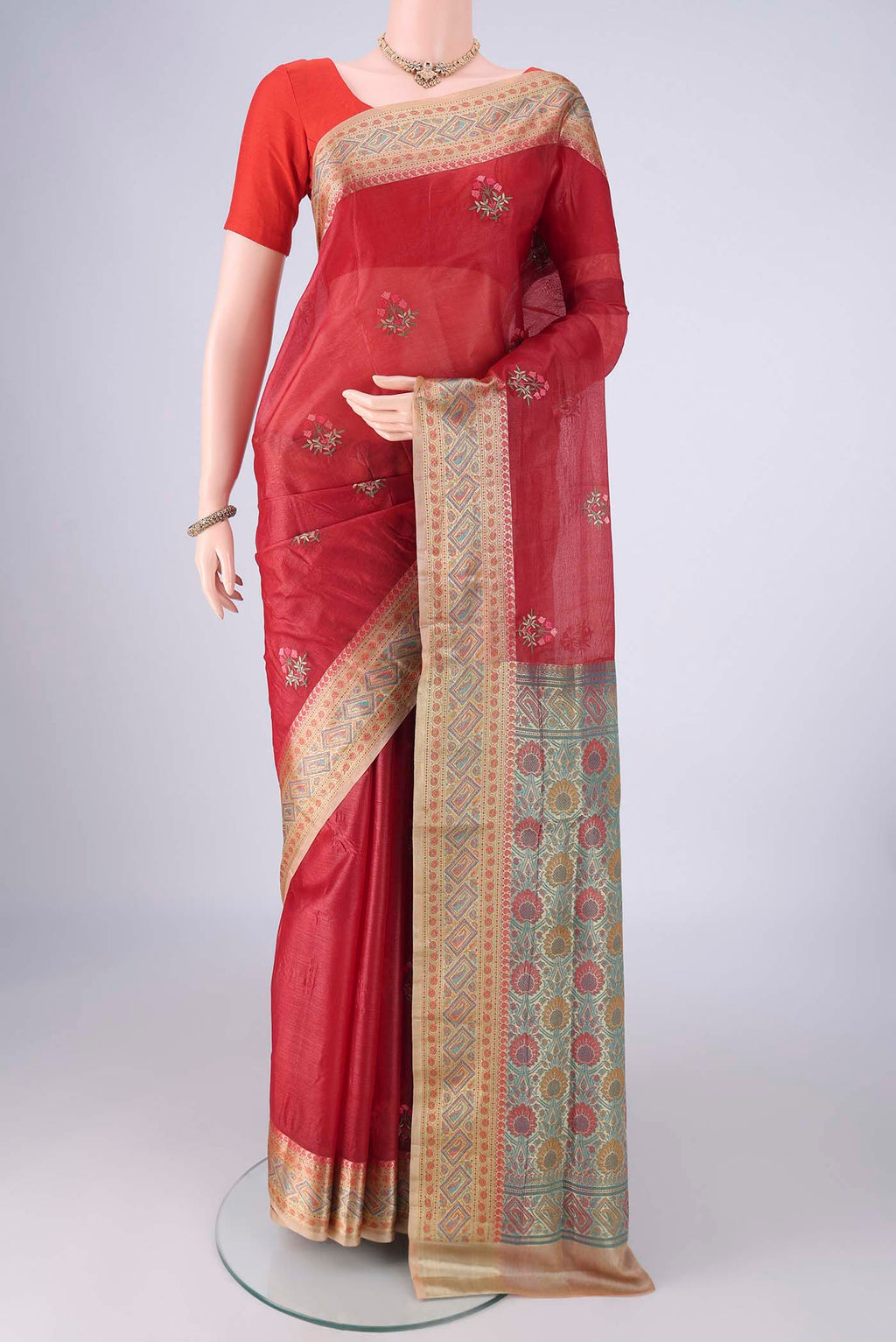 Red Banarasi Tussar Silk Saree with Embroidery on the body and Zari Border.  displayed on a mannequin