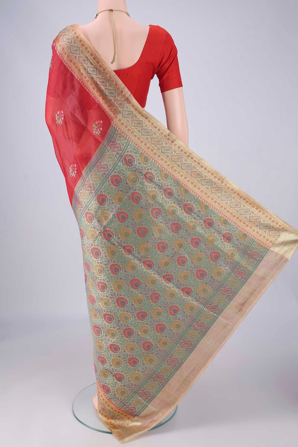 Flat view of Red Banarasi Tussar Silk Saree with Embroidery on the body and Zari Border. 