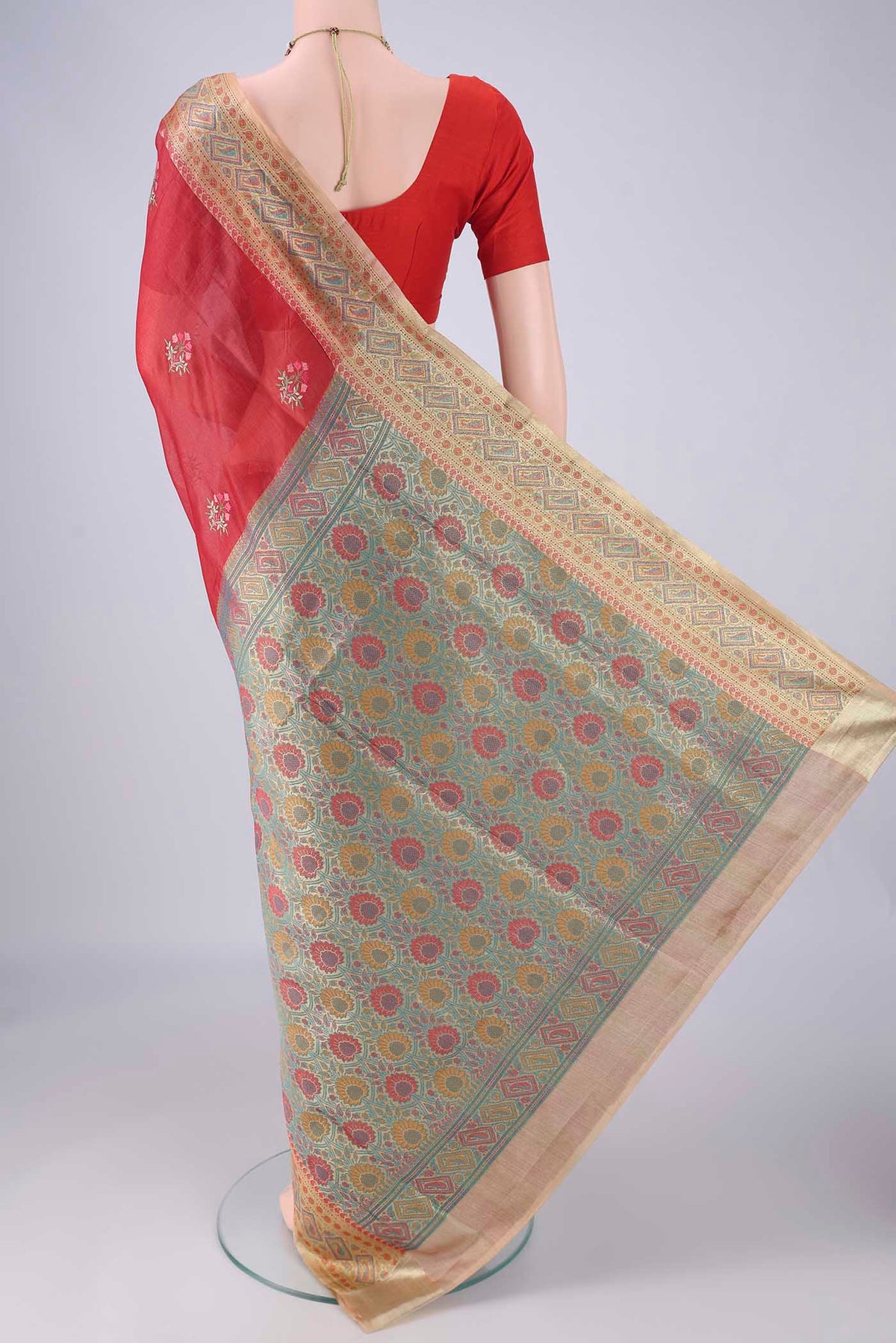 Flat view of Red Banarasi Tussar Silk Saree with Embroidery on the body and Zari Border. 