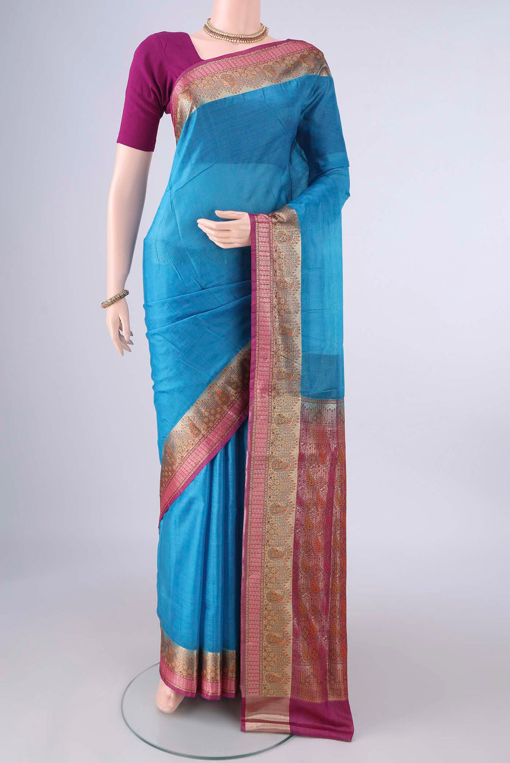 Blue Banarasi Tussar Saree with Plain Body and Zari Border.  displayed on a mannequin