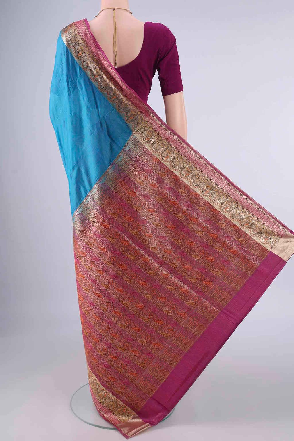 Flat view of Blue Banarasi Tussar Saree with Plain Body and Zari Border. 