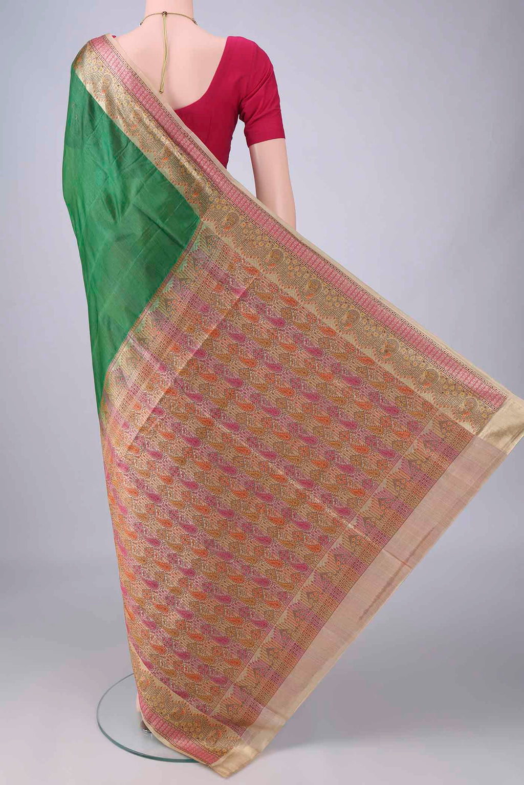 Flat view of Green Banarasi Tussar Saree with Plain Body and Zari Border. 