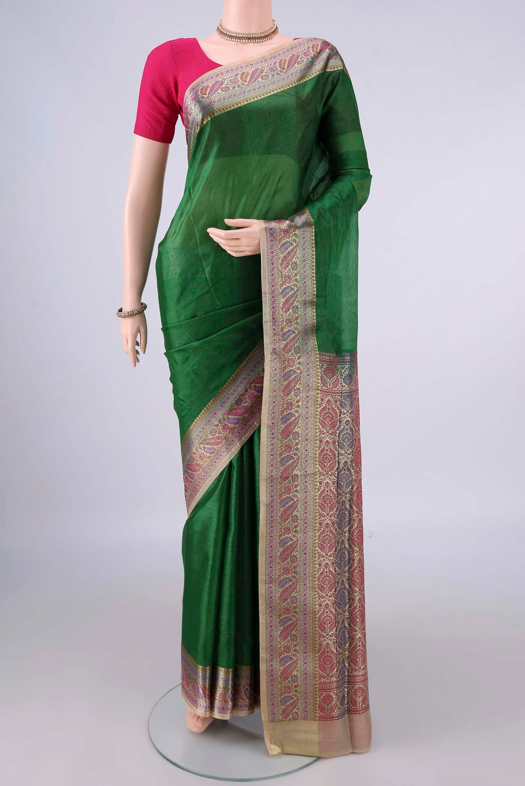 Green Banarasi Tussar Saree with Plain Body and Zari Border.  displayed on a mannequin