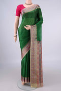 Green Banarasi Tussar Saree with Plain Body and Zari Border.  displayed on a mannequin
