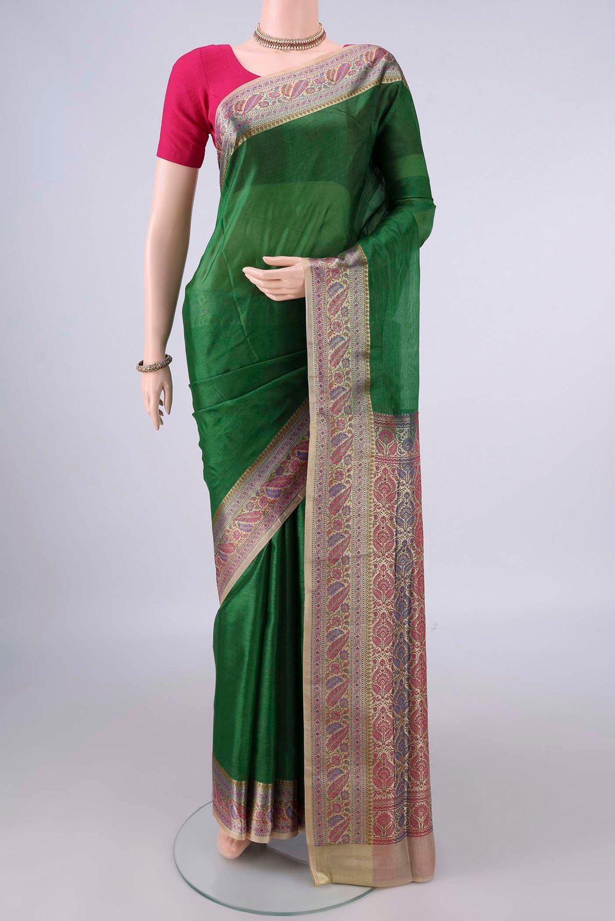 Green Banarasi Tussar Saree with Plain Body and Zari Border.  displayed on a mannequin