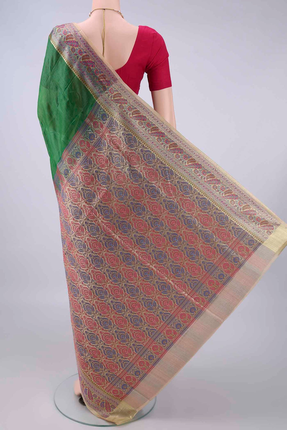 Flat view of Green Banarasi Tussar Saree with Plain Body and Zari Border. 