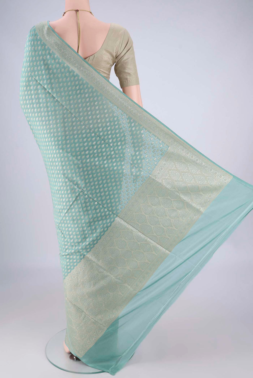 Flat view of Sky Blue Banarasi Silk Saree with Zari Brocade on the body and Zari Border. 