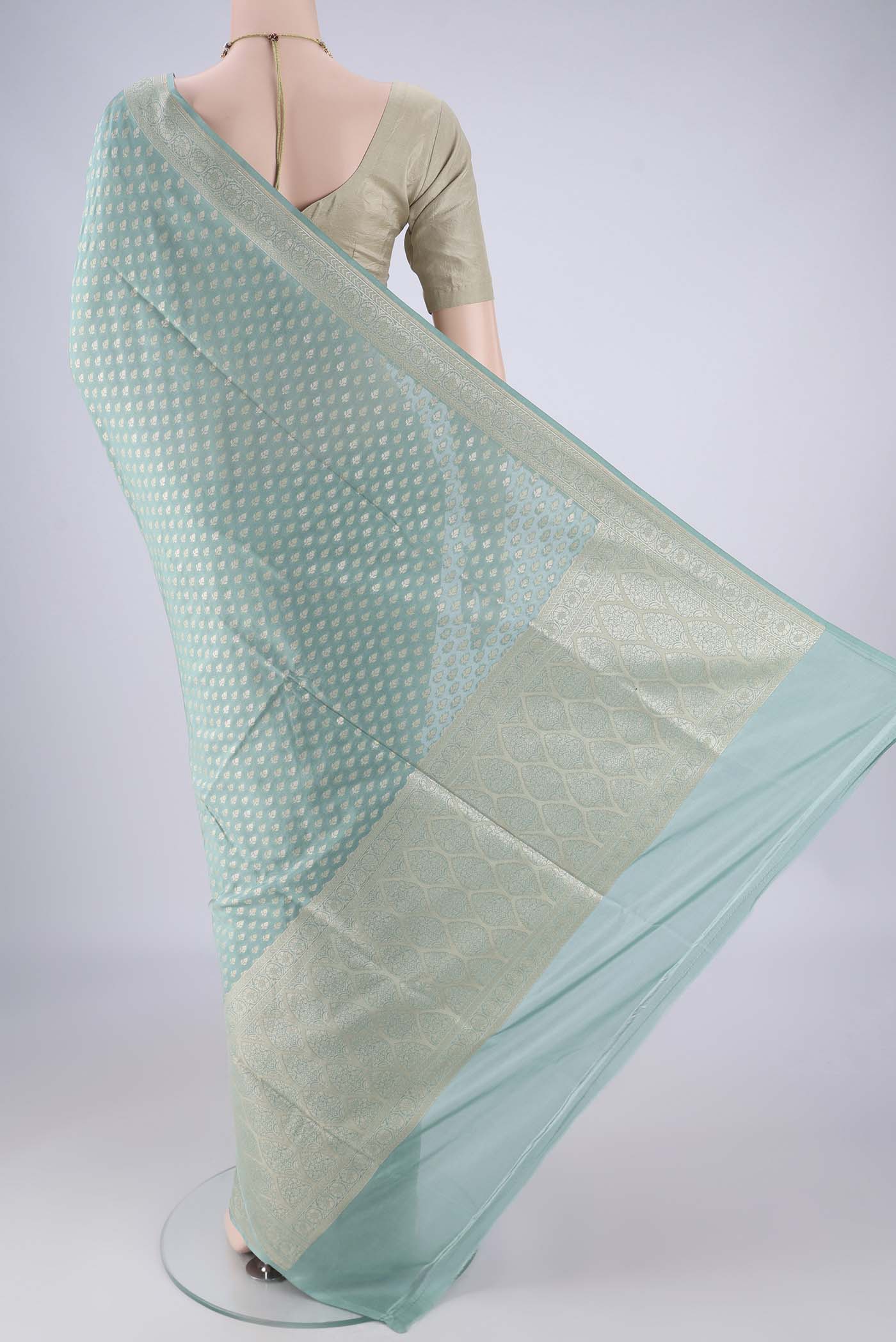 Flat view of Sky Blue Banarasi Silk Saree with Zari Brocade on the body and Zari Border. 