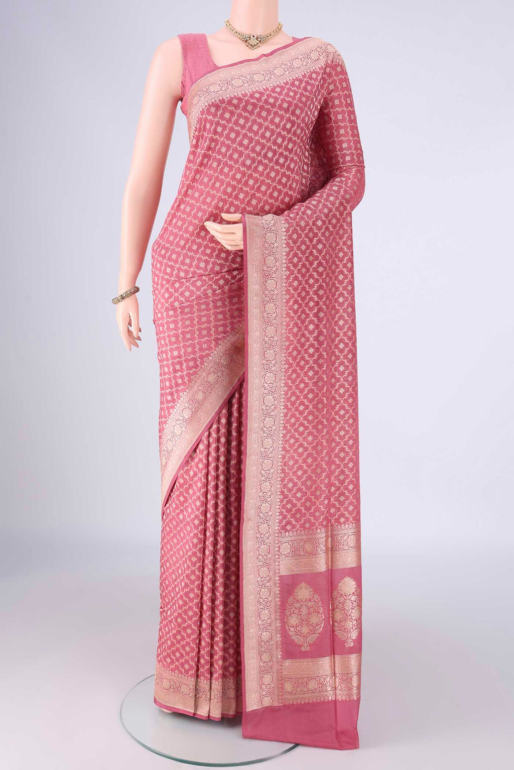 Rose pink Banarasi Silk Saree with Zari Brocade on the body and Zari Border.  displayed on a mannequin