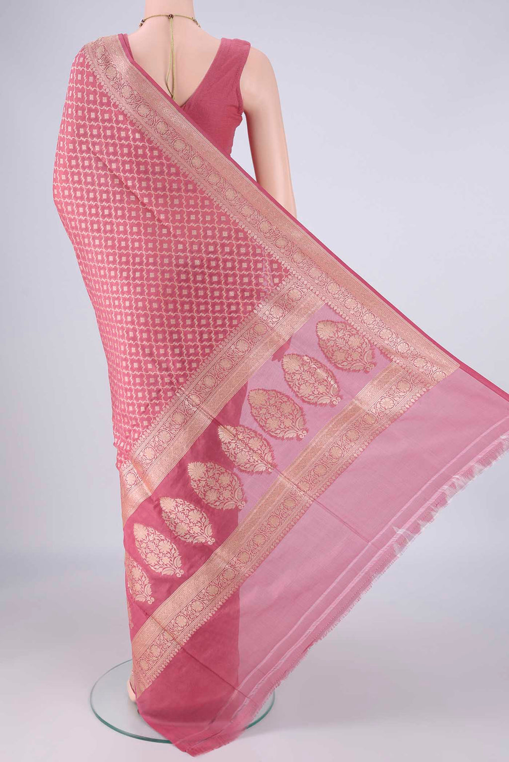 Flat view of Rose pink Banarasi Silk Saree with Zari Brocade on the body and Zari Border. 