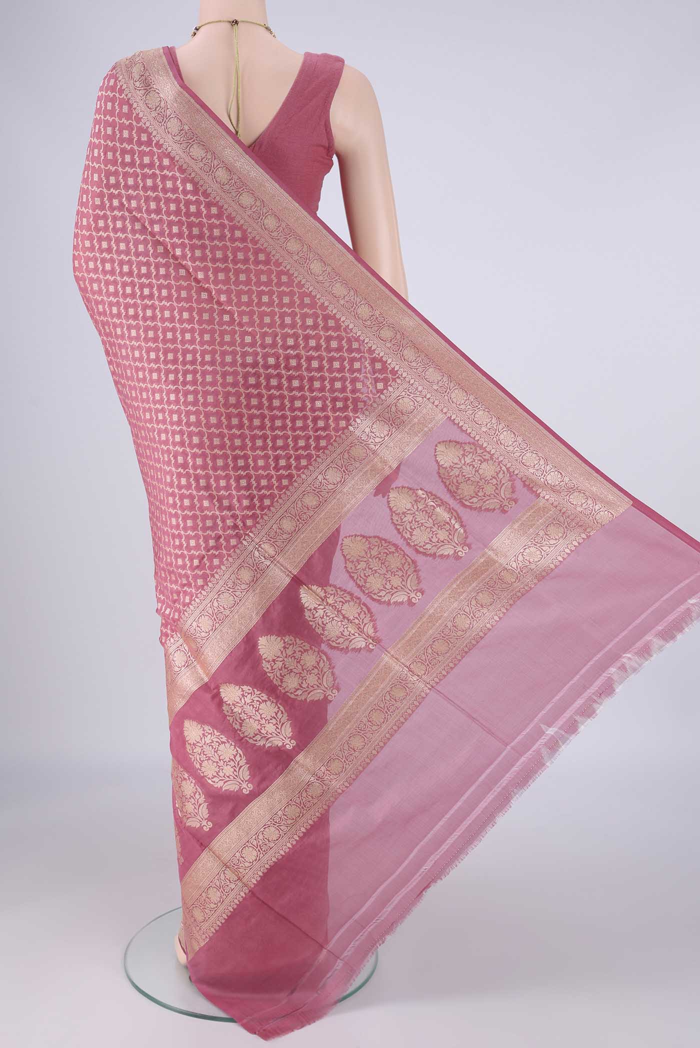 Flat view of Rose pink Banarasi Silk Saree with Zari Brocade on the body and Zari Border. 