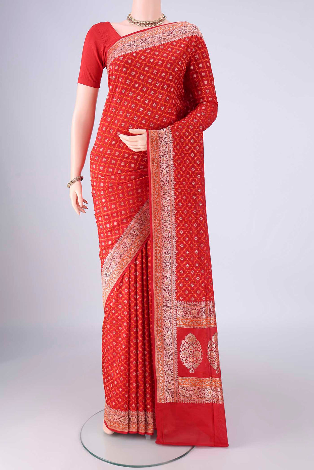 Red Banarasi Silk Saree with Zari And Thread Butta on the body and Zari And Thread Border.  displayed on a mannequin