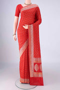 Red Banarasi Silk Saree with Zari And Thread Butta on the body and Zari And Thread Border.  displayed on a mannequin
