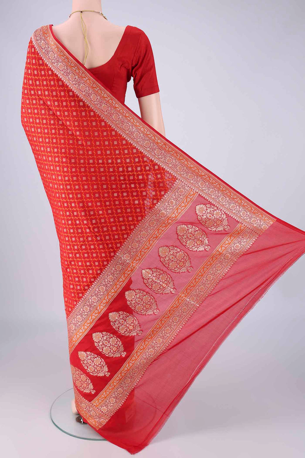 Flat view of Red Banarasi Silk Saree with Zari And Thread Butta on the body and Zari And Thread Border. 