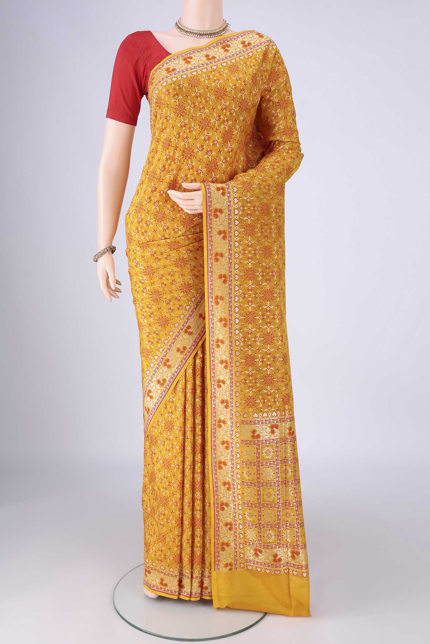 Yellow Banarasi Silk Saree with Zari And Thread Butta on the body and Zari And Thread Border.  displayed on a mannequin