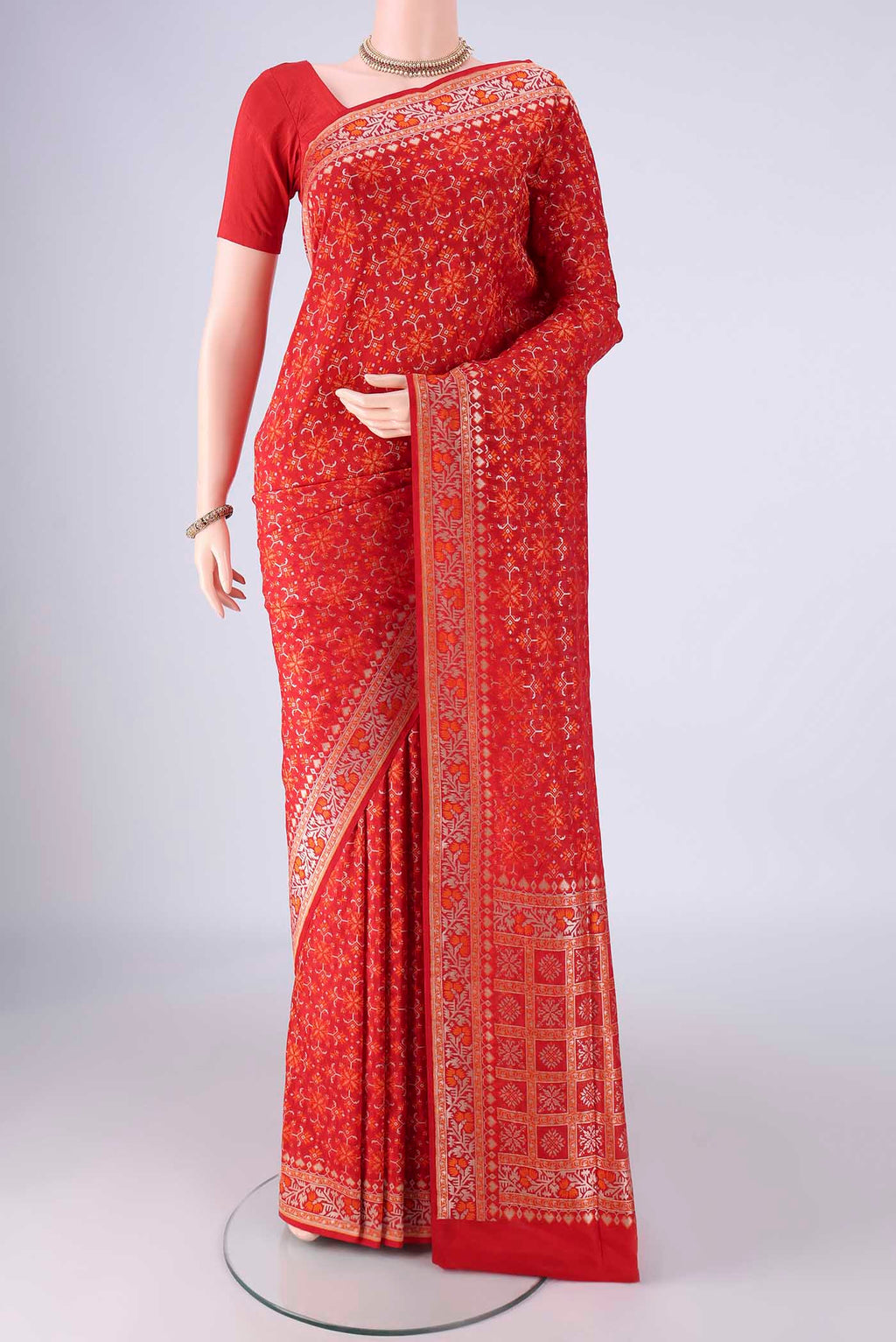 Red Banarasi Silk Saree with Zari And Thread Butta on the body and Zari And Thread Border.  displayed on a mannequin