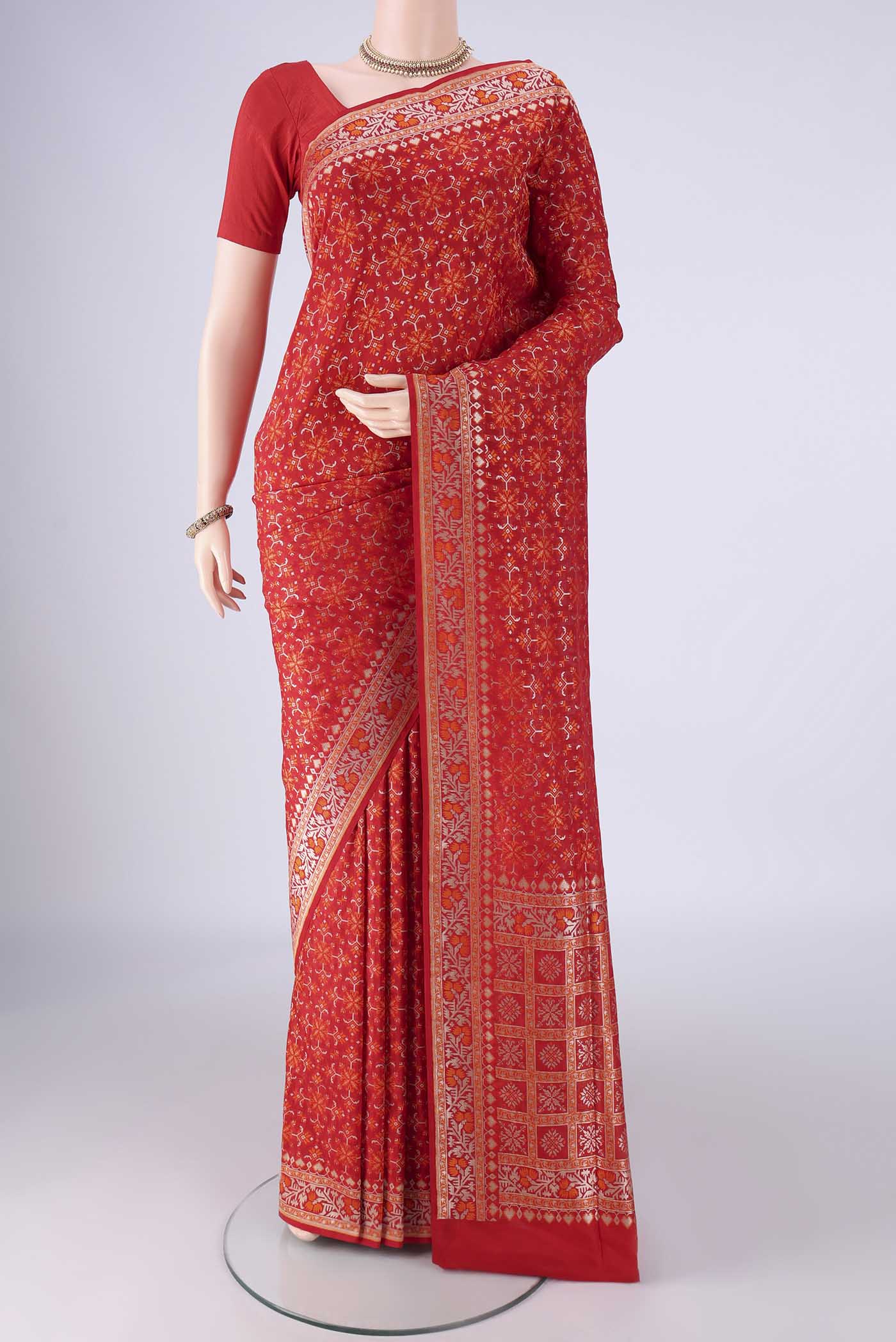 Red Banarasi Silk Saree with Zari And Thread Butta on the body and Zari And Thread Border.  displayed on a mannequin