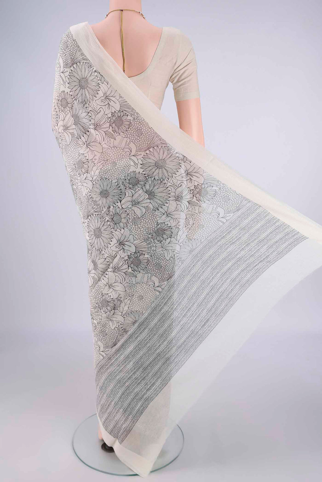 Flat view of Off White Chanderi Silk Cotton Saree with Floral Print on the body and Thread Border. 