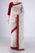 Off White Chanderi Silk Cotton Saree with Printed design on the body and Thread Border.  displayed on a mannequin