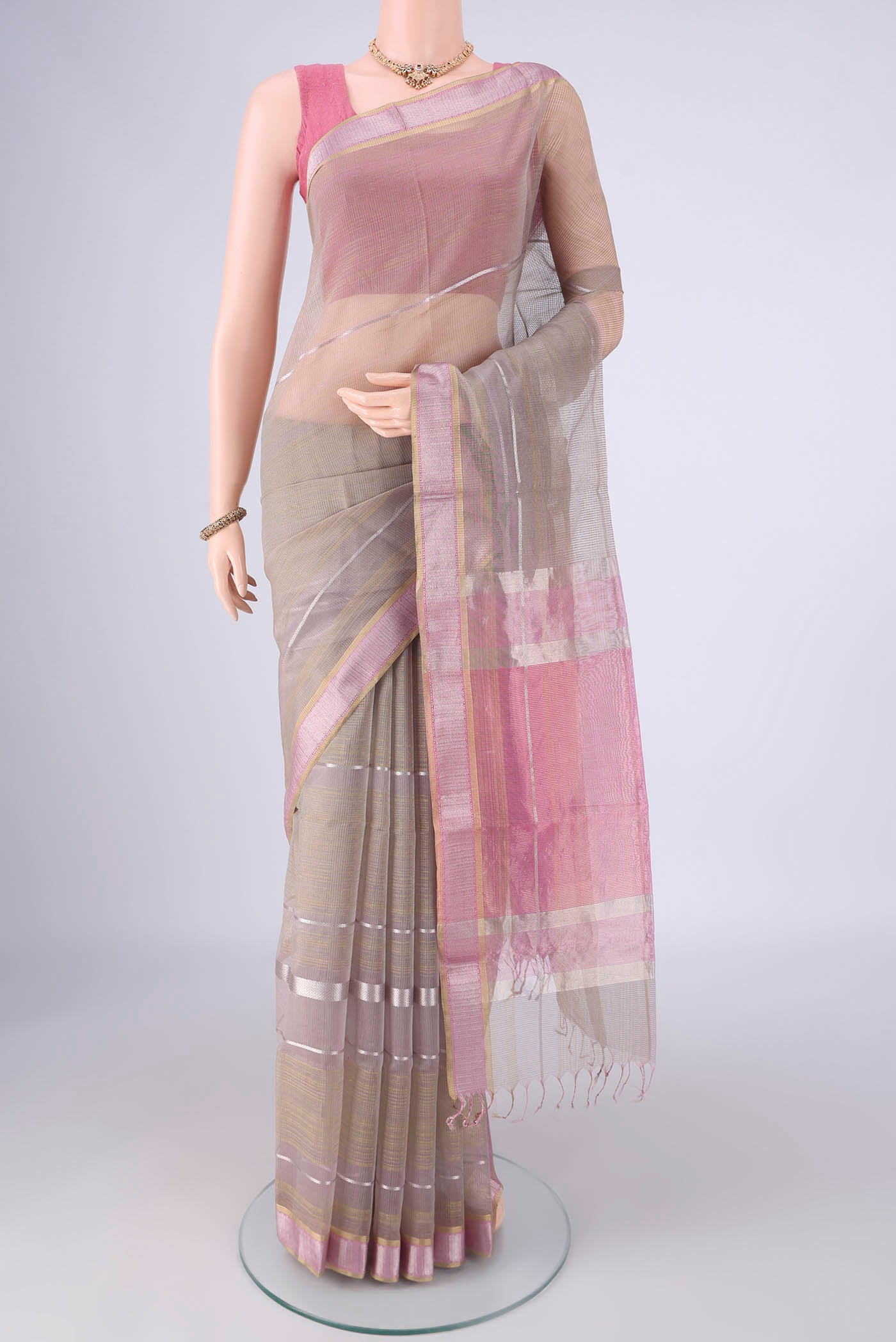 Davys Grey Maheshwari Silk Cotton Saree with Stripes on the body and Zari Border.  displayed on a mannequin