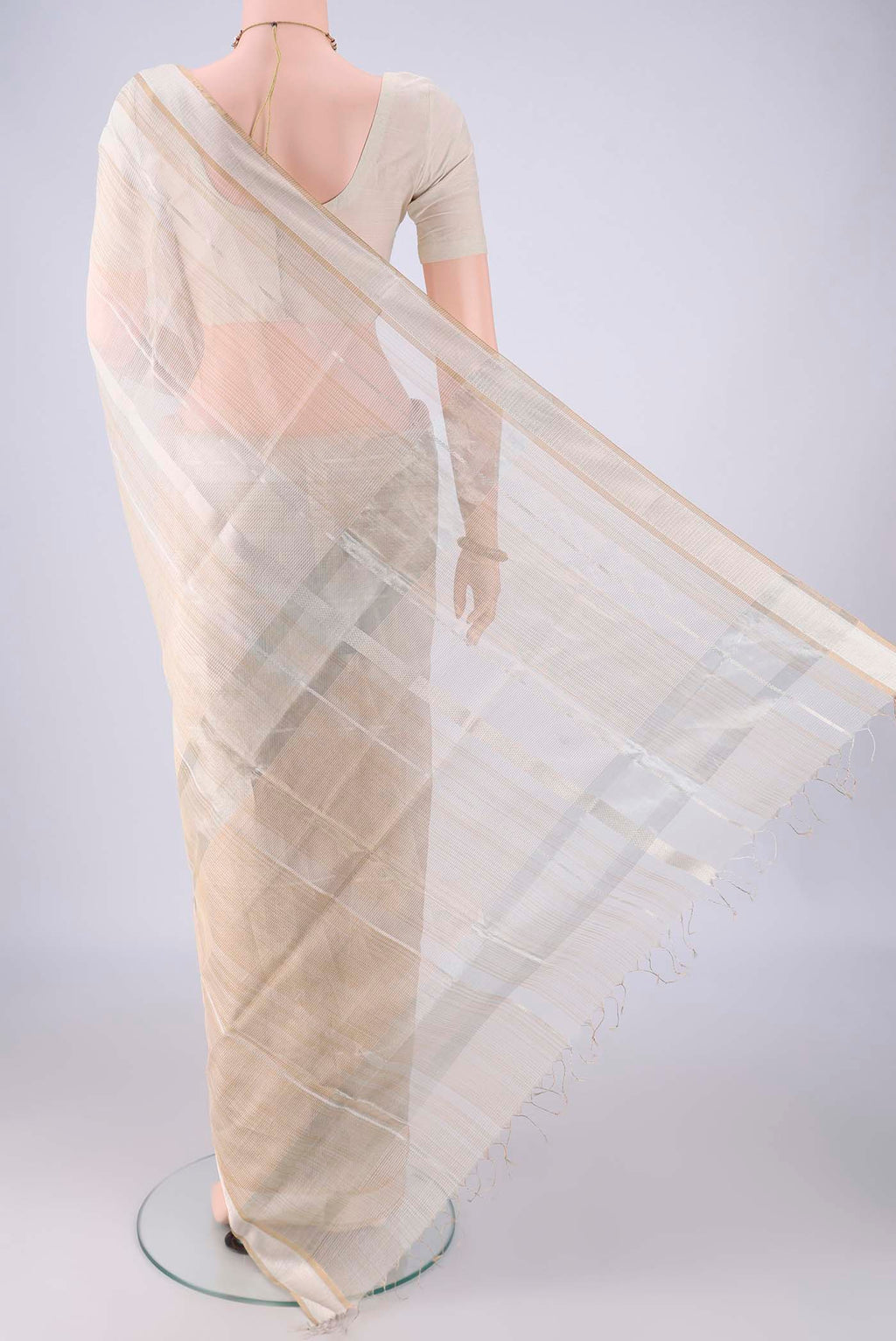 Flat view of Off White Maheshwari Silk Cotton Saree with Stripes on the body and Zari Border. 