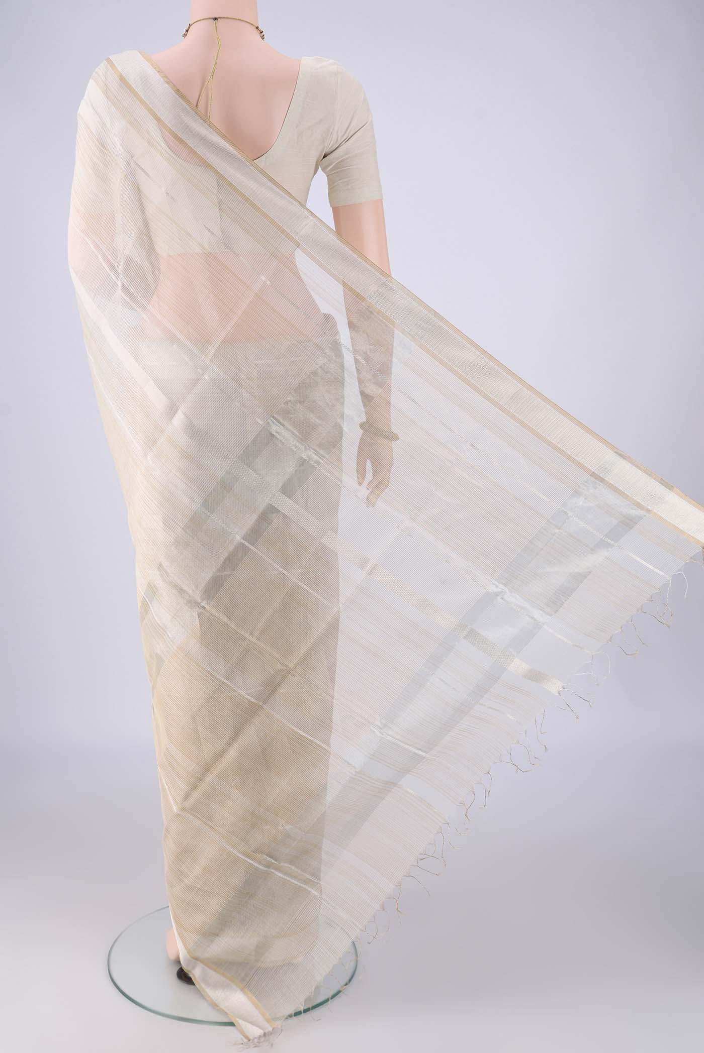 Flat view of Off White Maheshwari Silk Cotton Saree with Stripes on the body and Zari Border. 