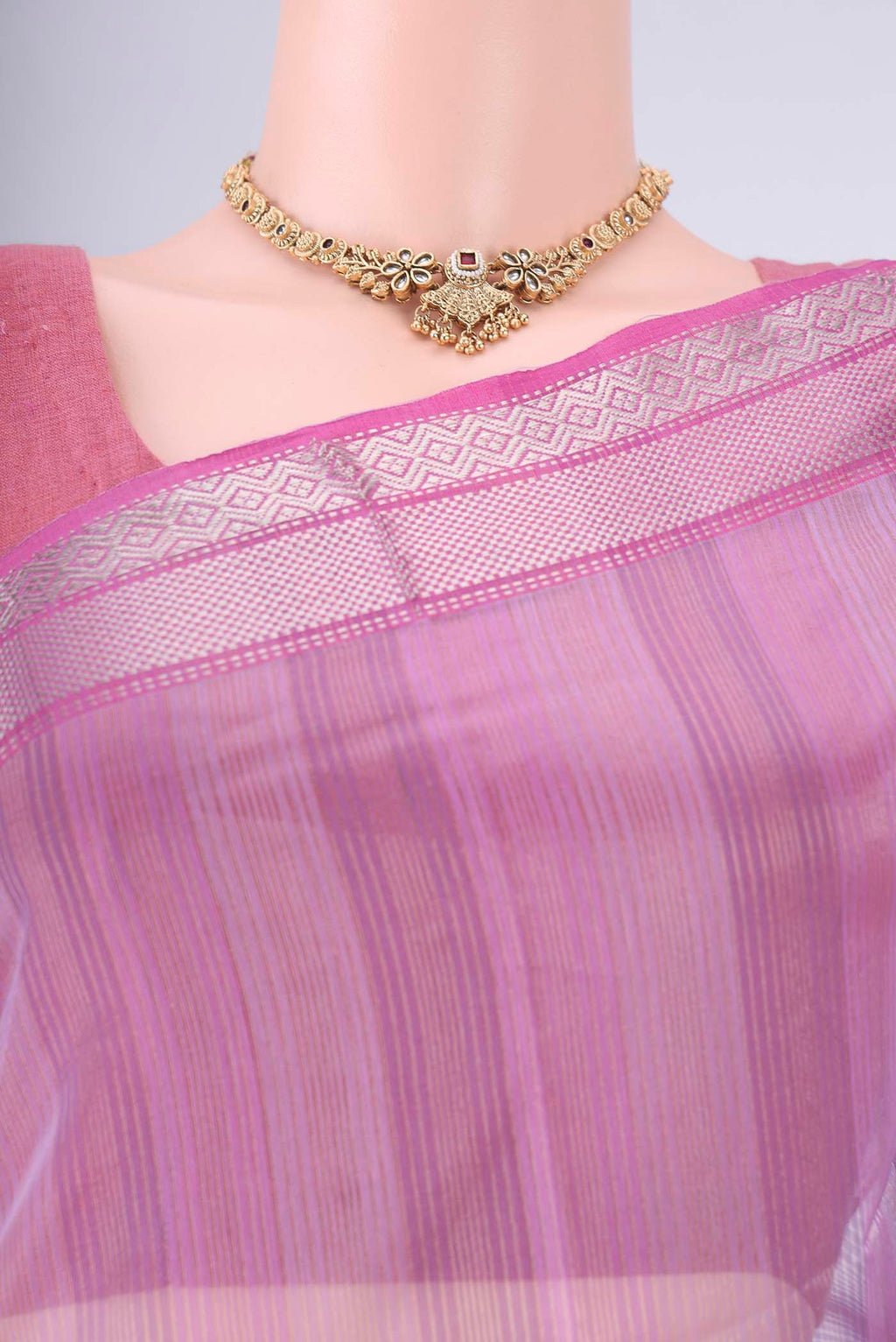 Border image of Lavender Maheshwari Silk Cotton Saree with Stripes on the body and Zari Border. 