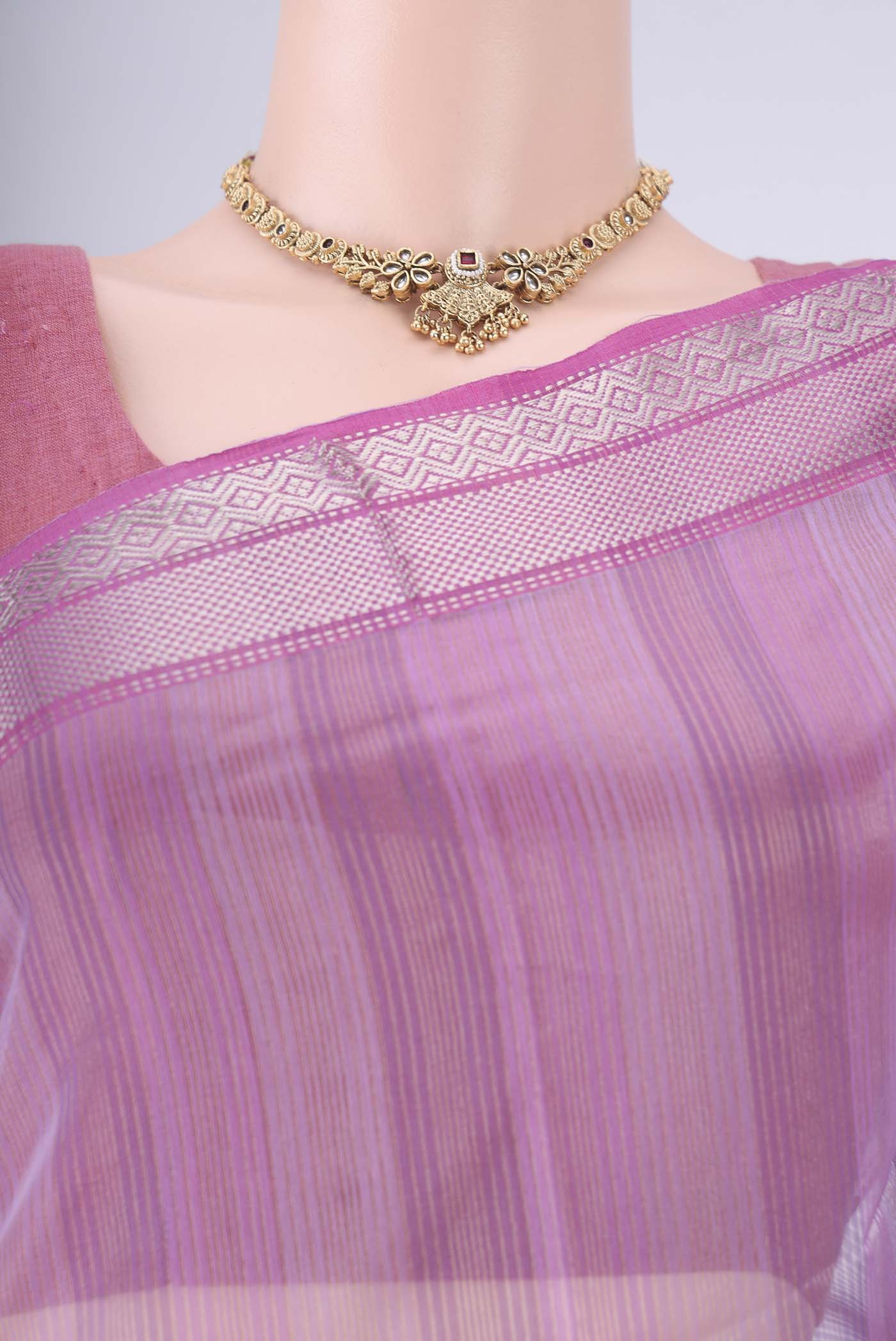 Border image of Lavender Maheshwari Silk Cotton Saree with Stripes on the body and Zari Border. 