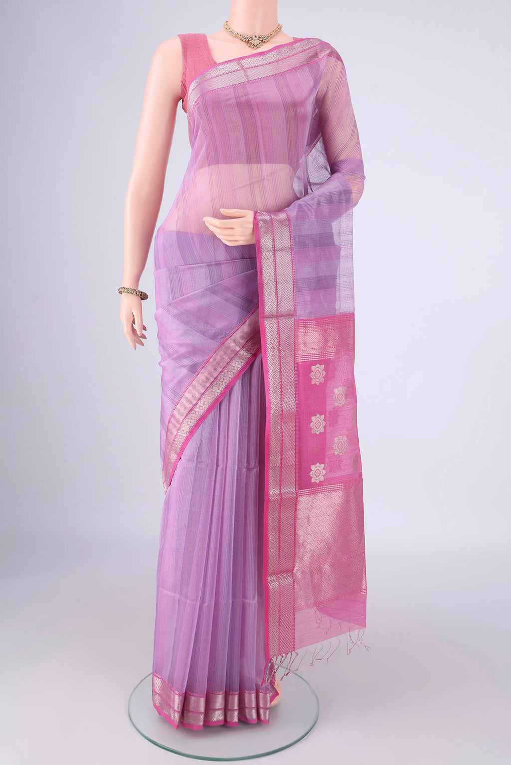 Lavender Maheshwari Silk Cotton Saree with Stripes on the body and Zari Border.  displayed on a mannequin