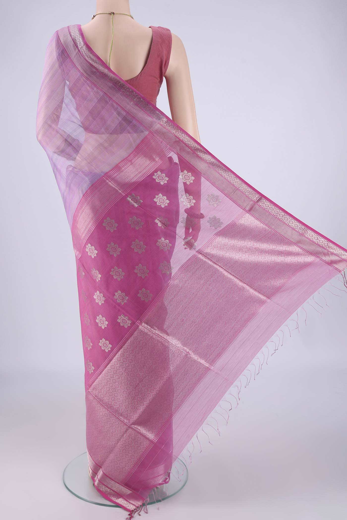 Flat view of Lavender Maheshwari Silk Cotton Saree with Stripes on the body and Zari Border. 