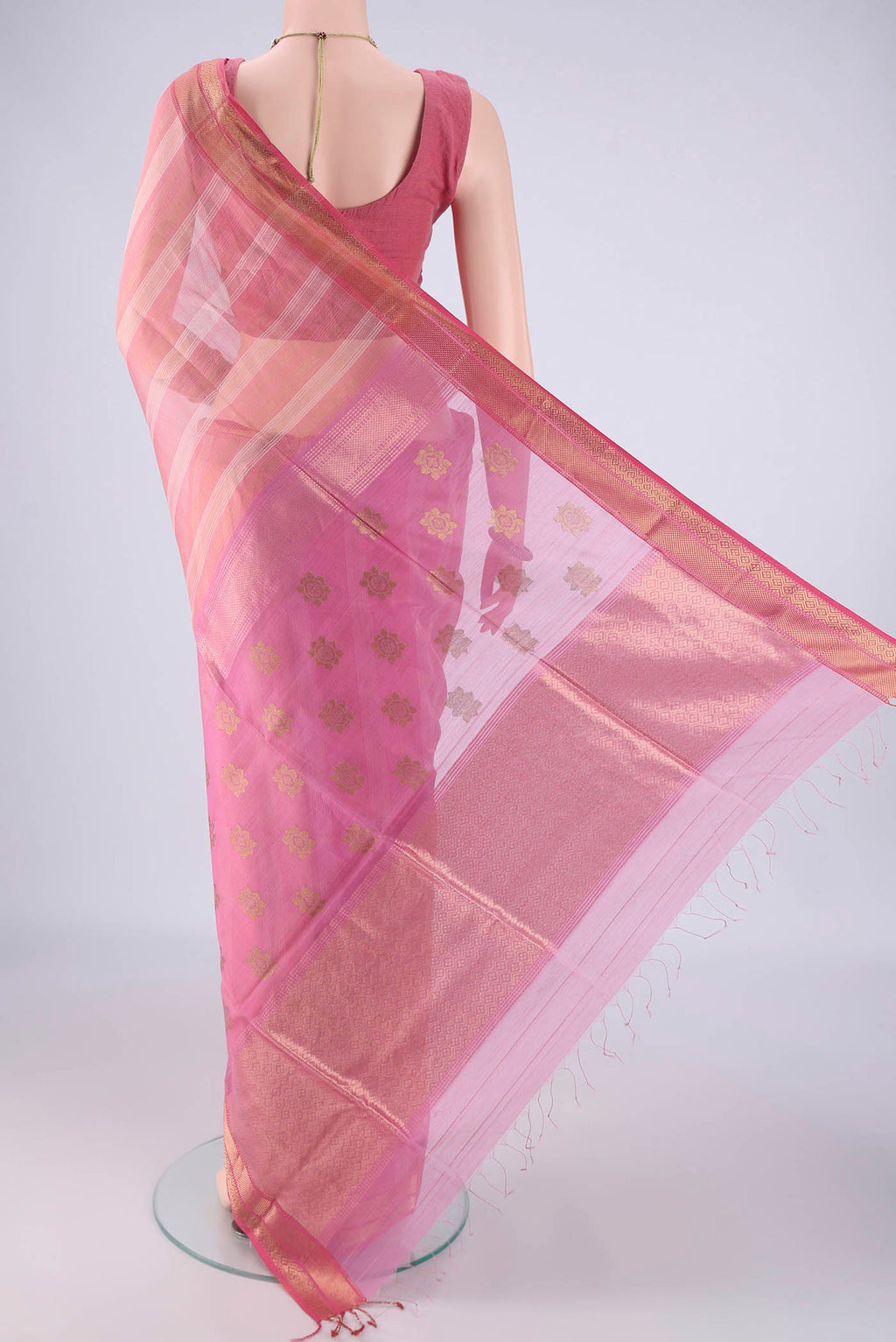 Flat view of Peach Maheshwari Silk Cotton Saree with Stripes on the body and Zari Border. 