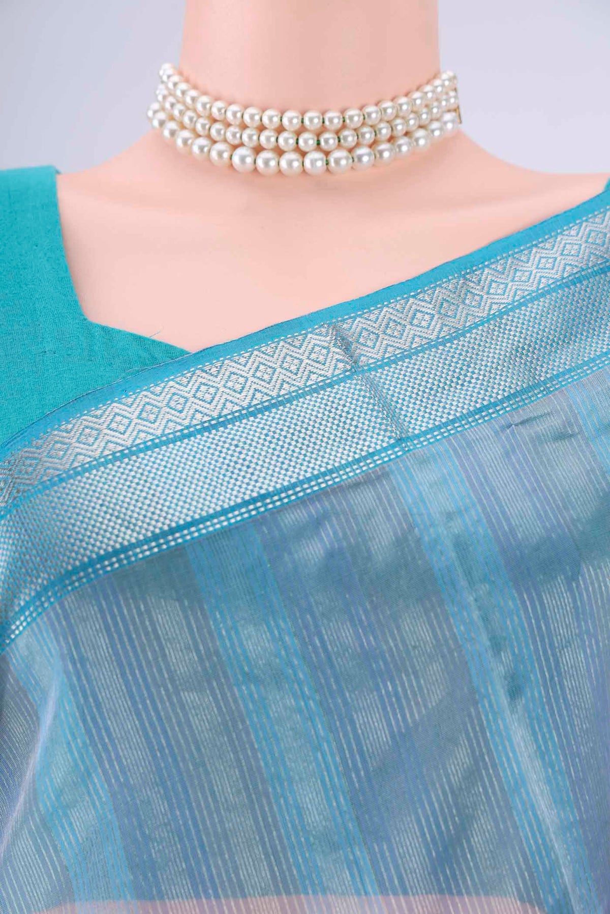 Border image of Sky Blue Maheshwari Silk Cotton Saree with Stripes on the body and Zari Border. 