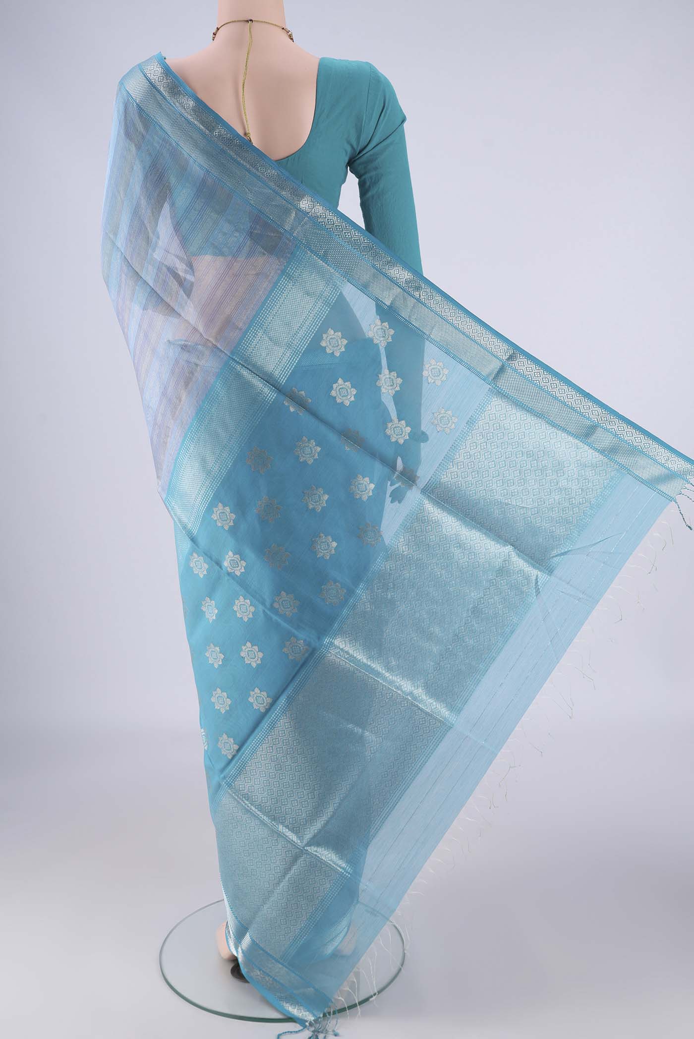 Flat view of Sky Blue Maheshwari Silk Cotton Saree with Stripes on the body and Zari Border. 