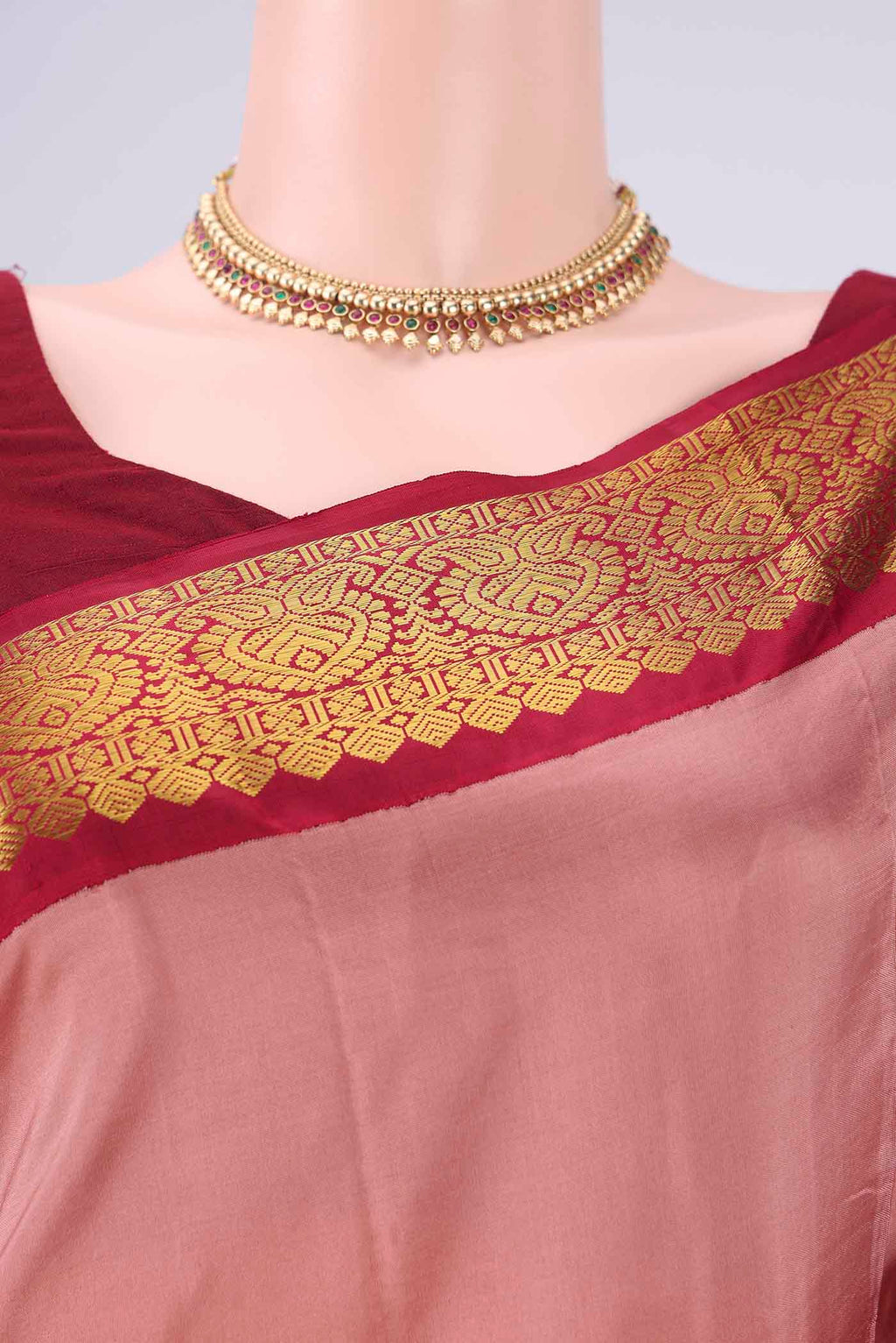 Border image of Coral Dual Tone Kanjivaram Silk Saree with Plain Body and Zari Border. 