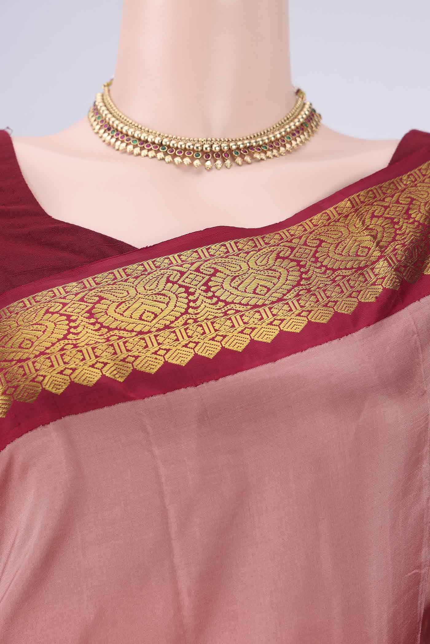 Border image of Coral Dual Tone Kanjivaram Silk Saree with Plain Body and Zari Border. 