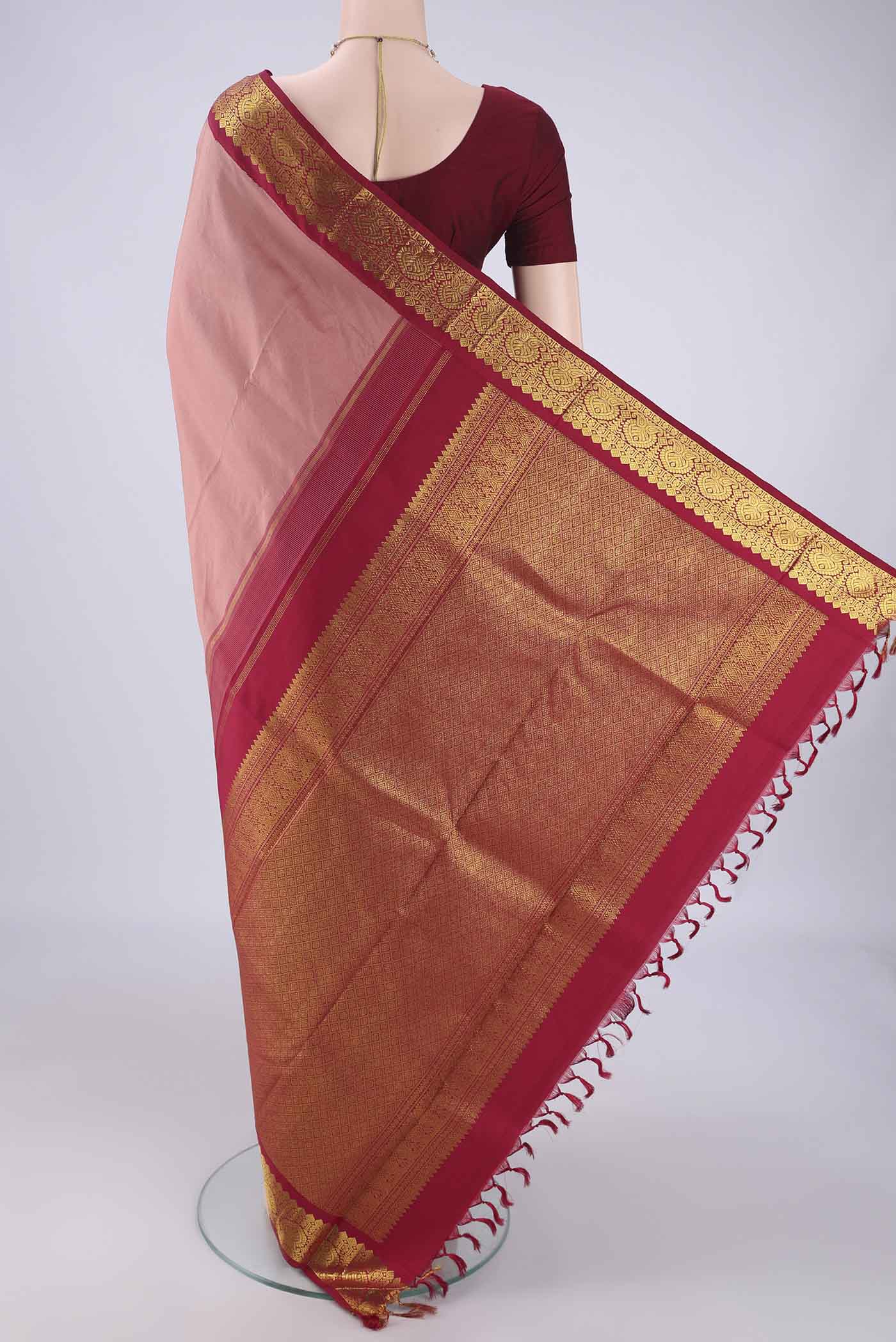 Flat view of Coral Dual Tone Kanjivaram Silk Saree with Plain Body and Zari Border. 